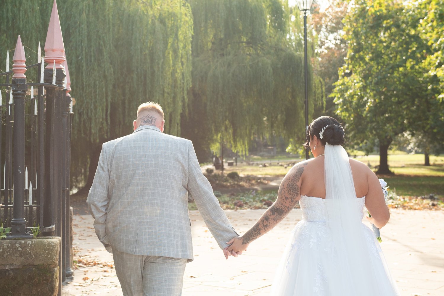 Newlyweds walking together in golden light