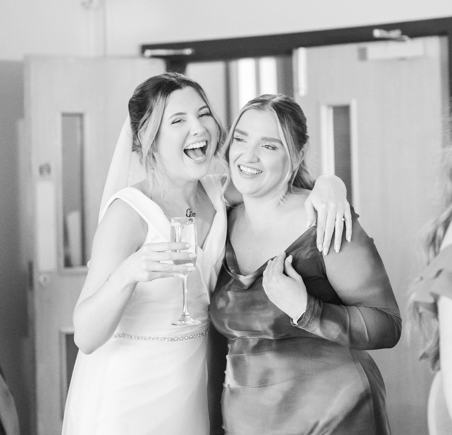 Bride and guest laughing